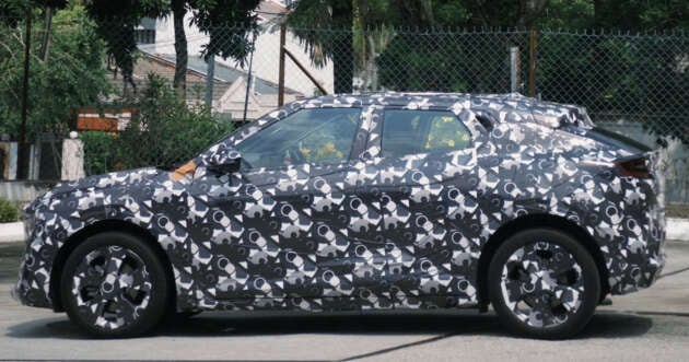 Perodua &lsquo;QV-E&rsquo; EV spied again in Malaysia &ndash; sloping roofline, small side window revealed; debut in Q4 2025
